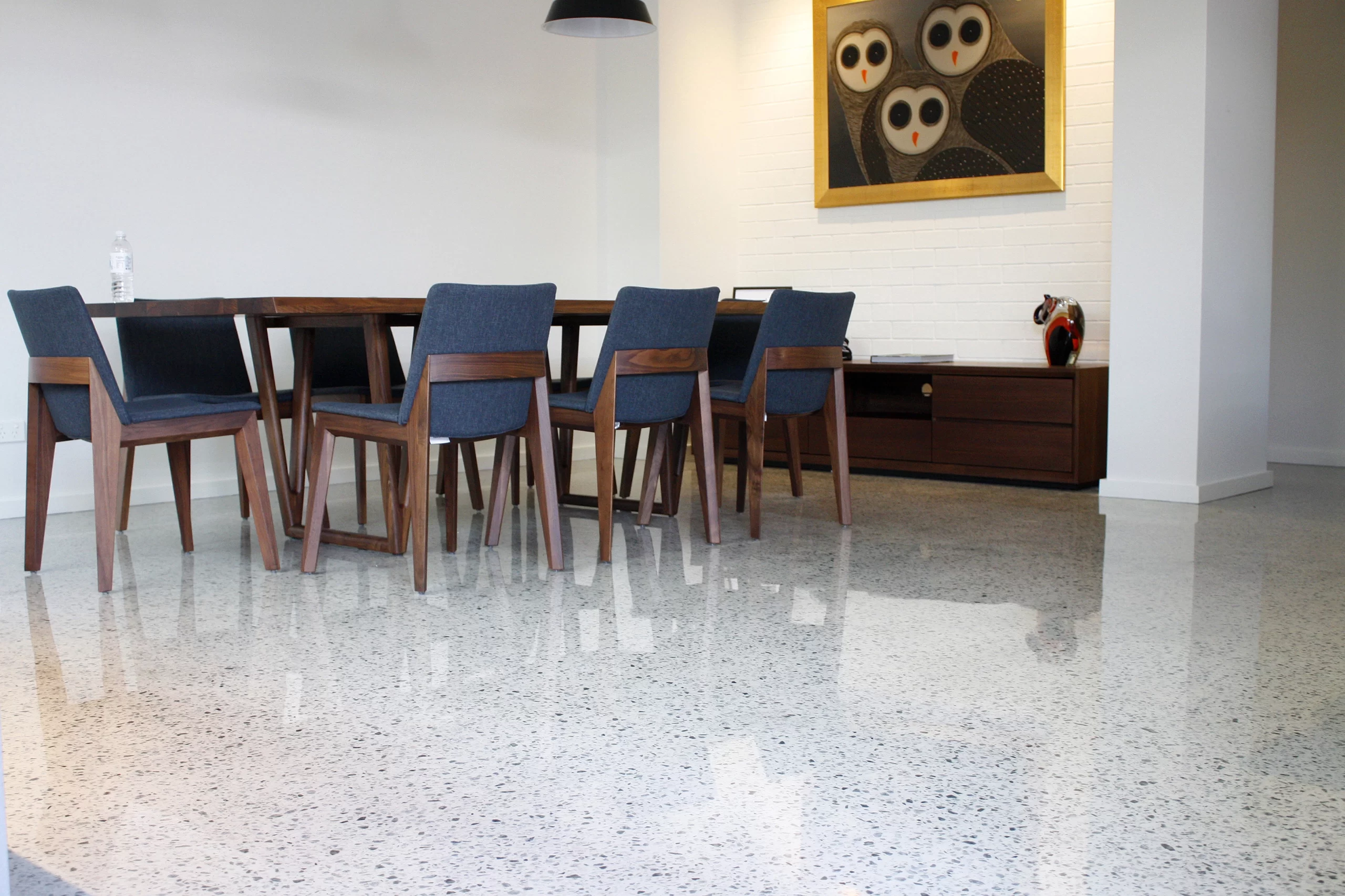 Light grey flake internal epoxy floor applied to a living room