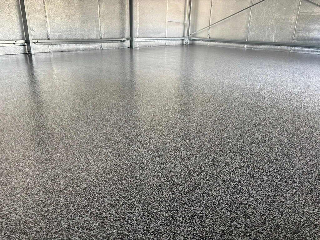 Dark grey flake internal epoxy floor in garage