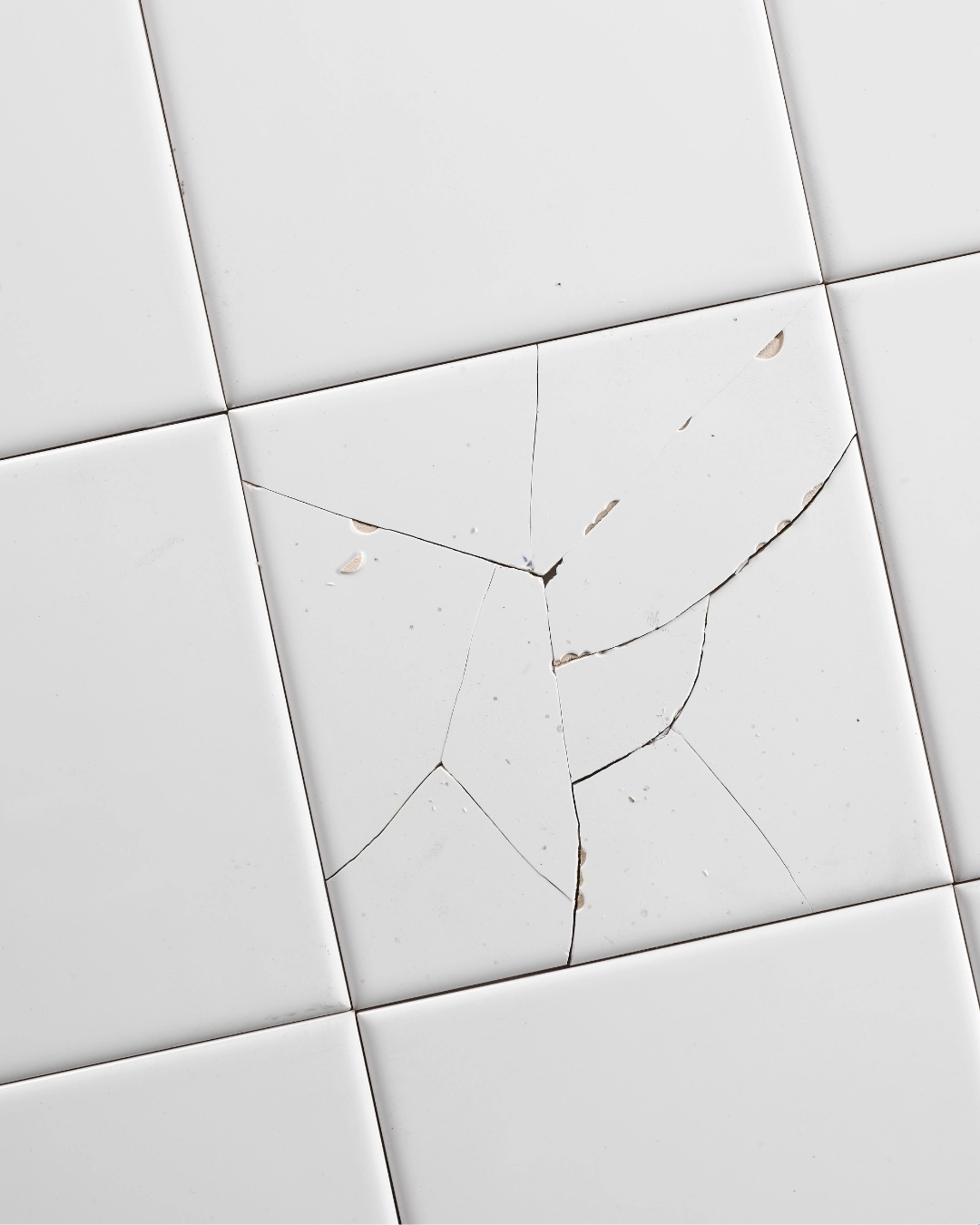 Loose, cracked or lifting tiles