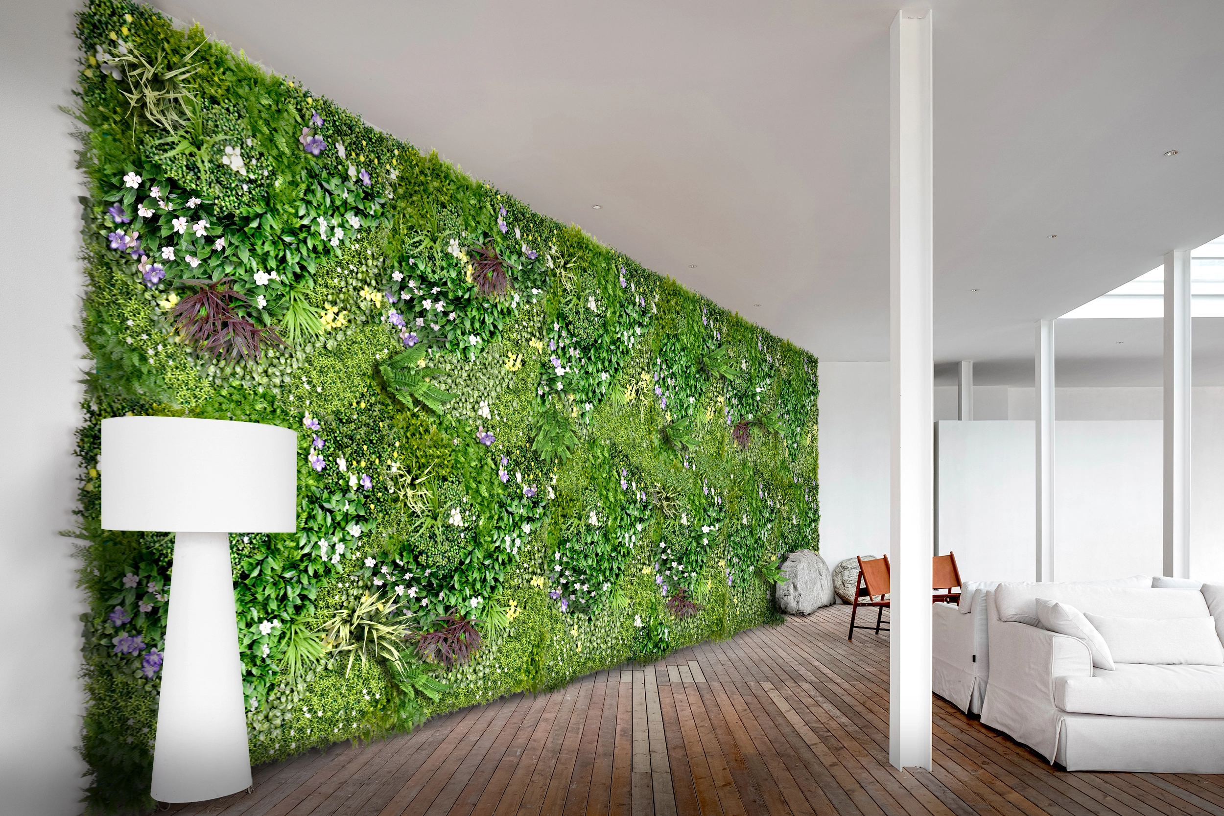 Large wall covered with artificial green wall panels