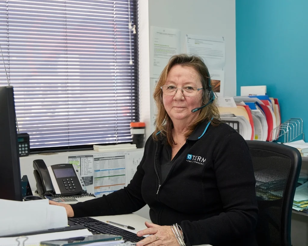 Female office worker wearing a telephone headset