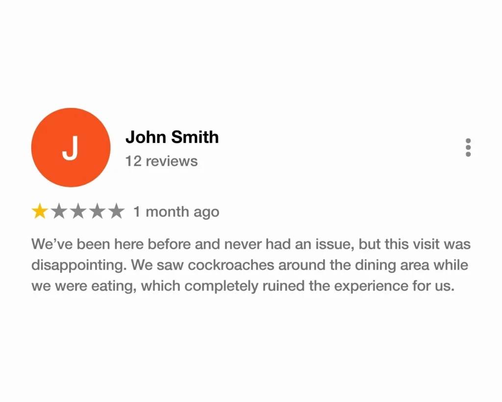 Fake Google review left by John Smith about seeing cockroaches at a restaurant