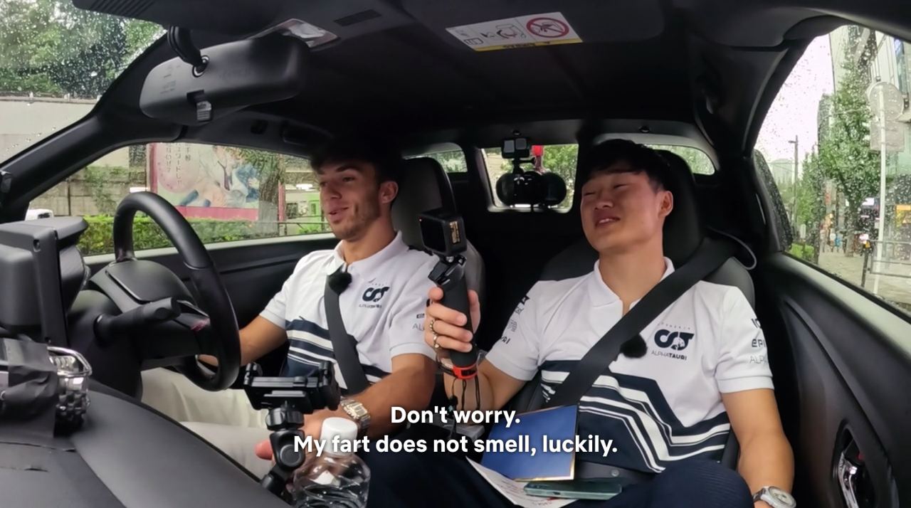Netflix Drive to Survive scene of Yuki farting in the car while Pierre drives through the streets of Tokyo