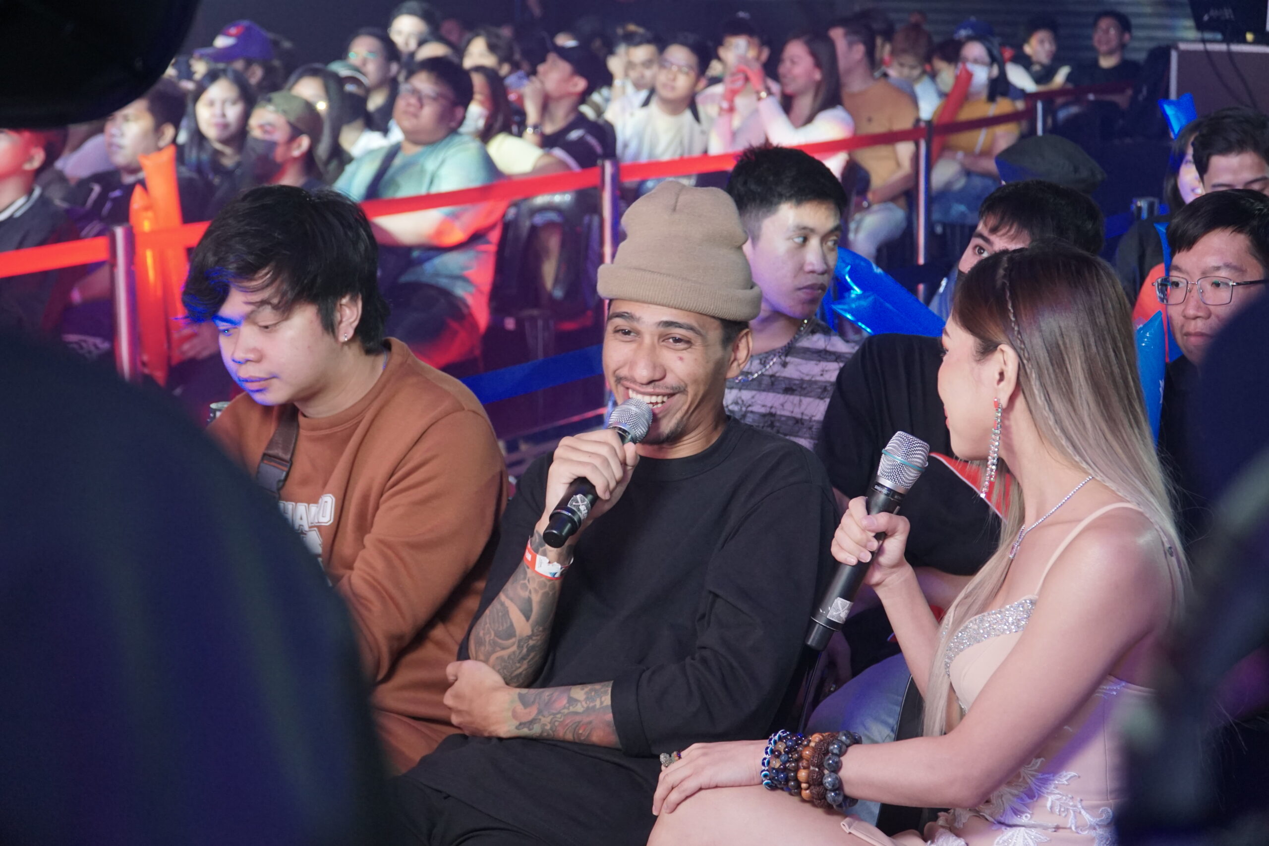 Hall of Legends inductee Naser "Dogie" Mollazehi watches the opening game between Smart Omega and Minana EVOS. 