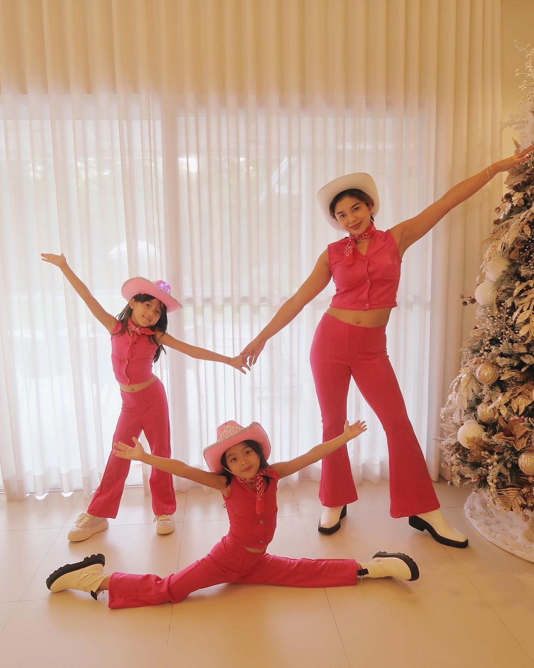 Filipina volleyball player Fille Cainglet-Cayetano with her daughters