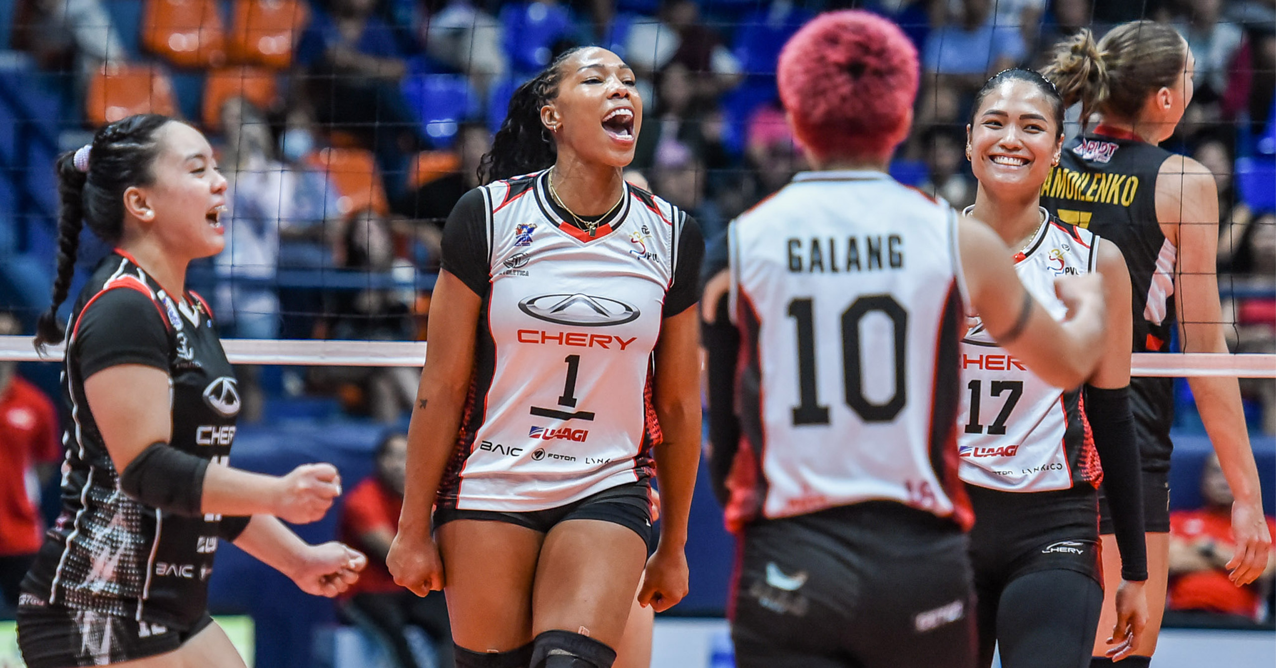 Khat Bell celebrates with Ara Galang, Karen Verdeflor and Seth Rodriguez in the background