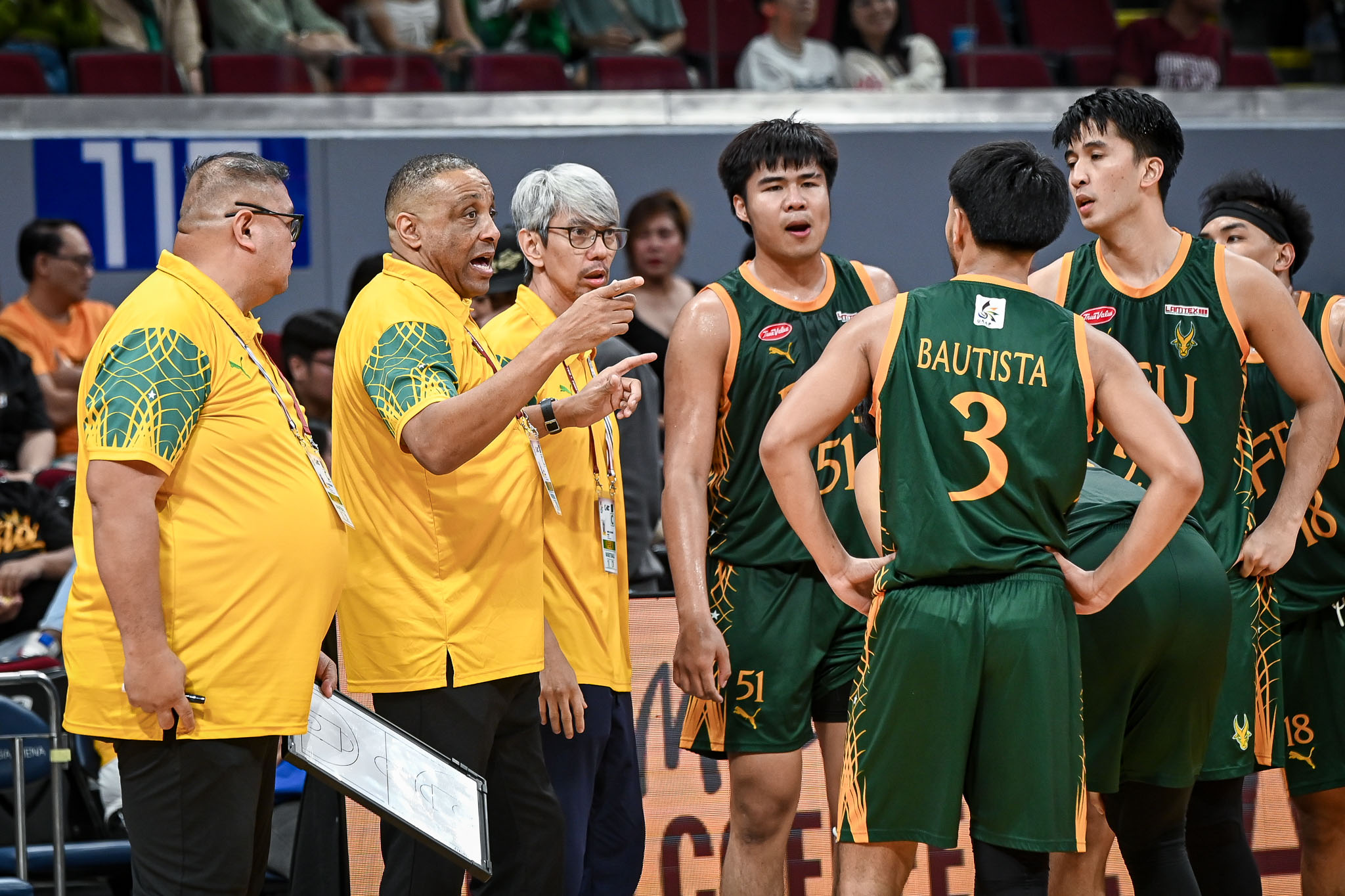 FEU's coaching staff giving instructions