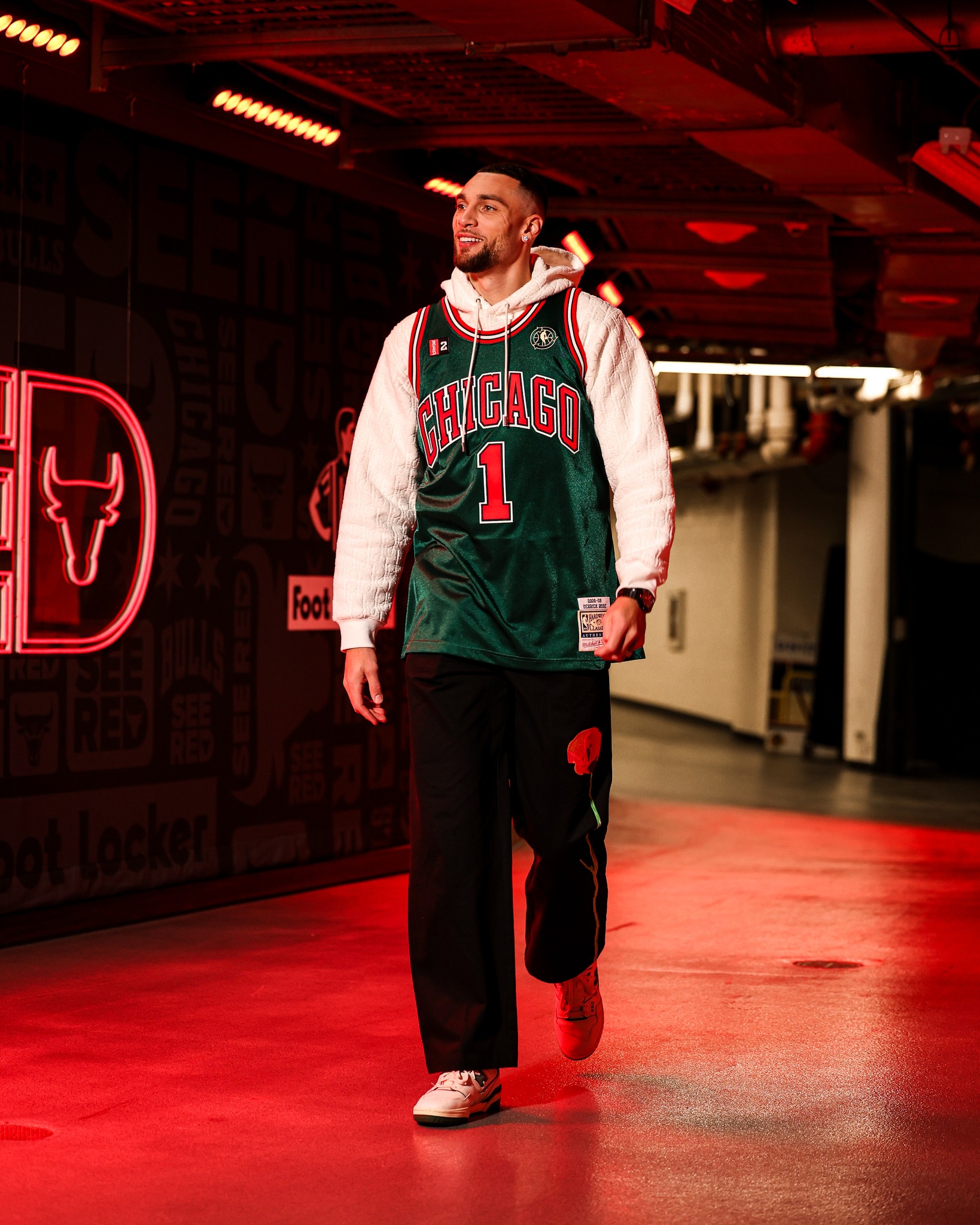 Zach Lavine wearing a St. Patrick's Day Derrick Rose Jersey.