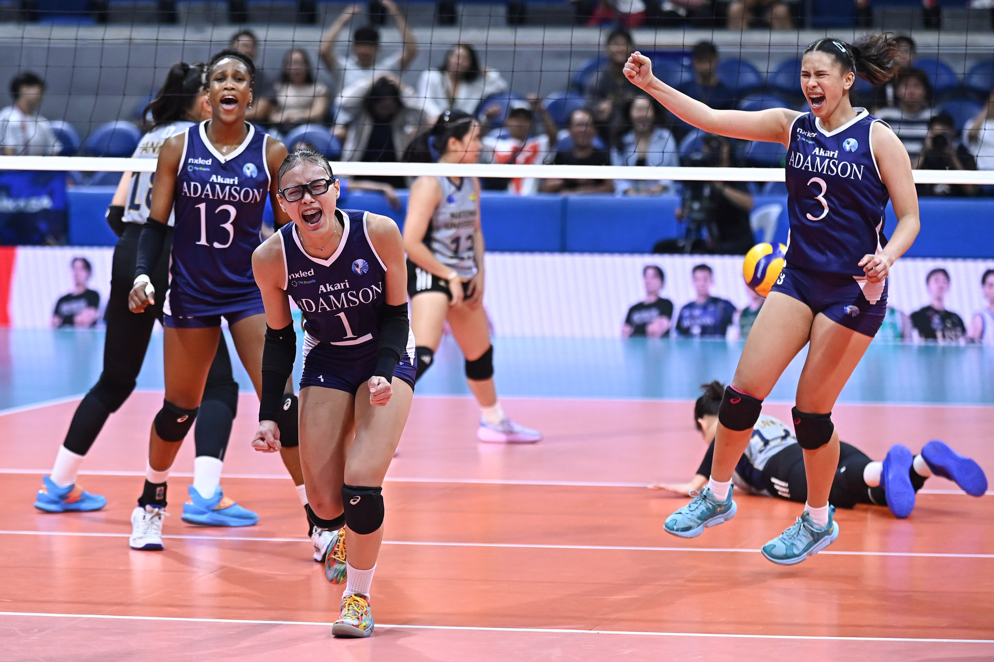 Shaina Nitura and the Adamson Lady Falcons after upsetting the NU Lady Bulldogs