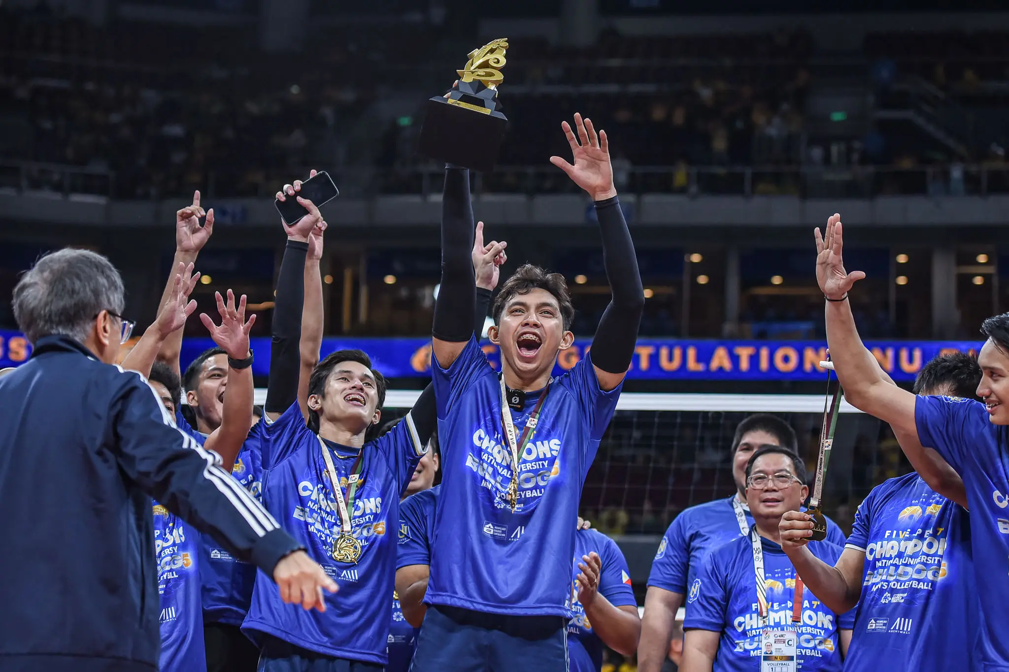 A shot of Leo Aringo celebrating the UAAP title