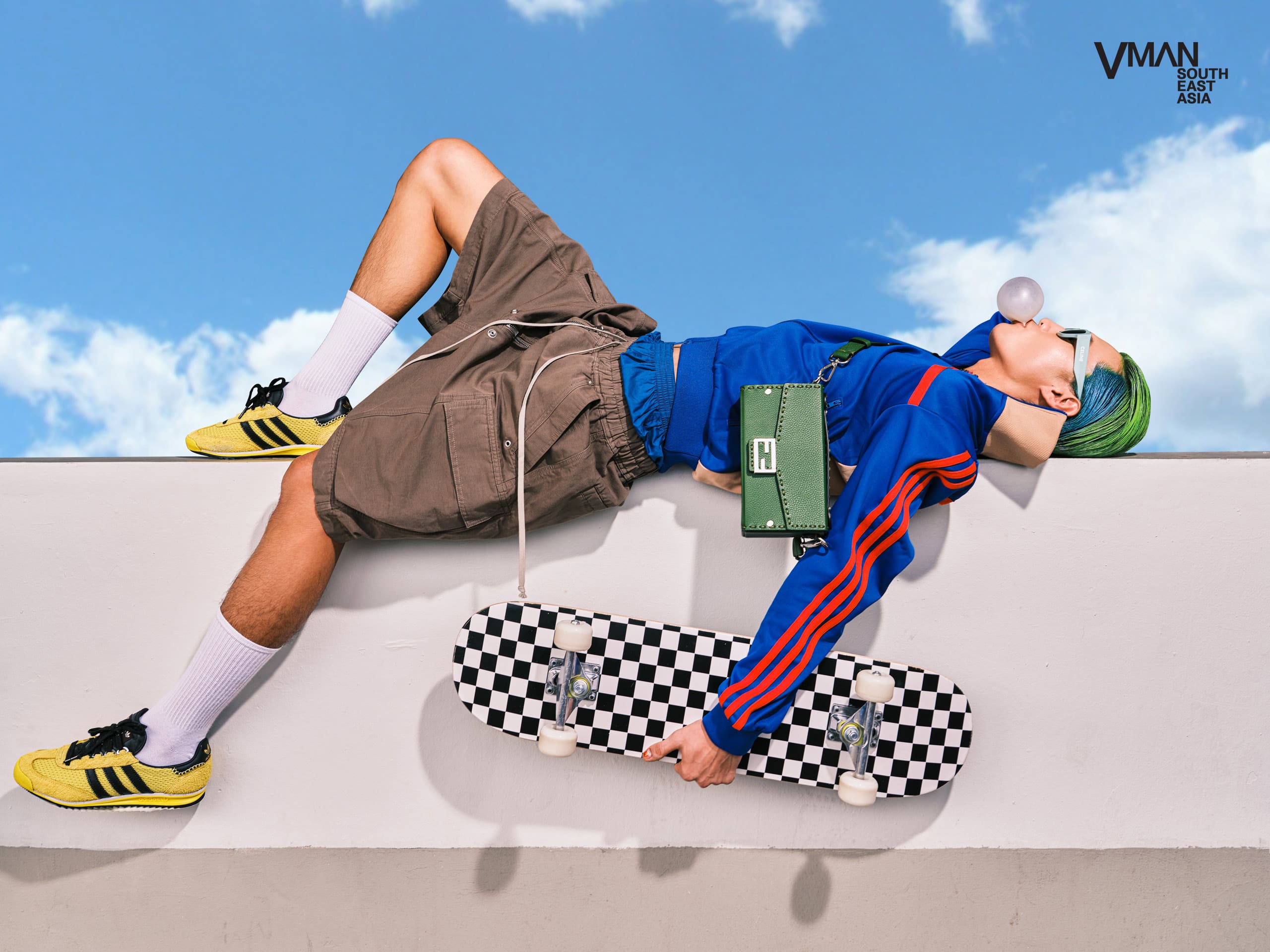 cole chung posing holding a skateboard