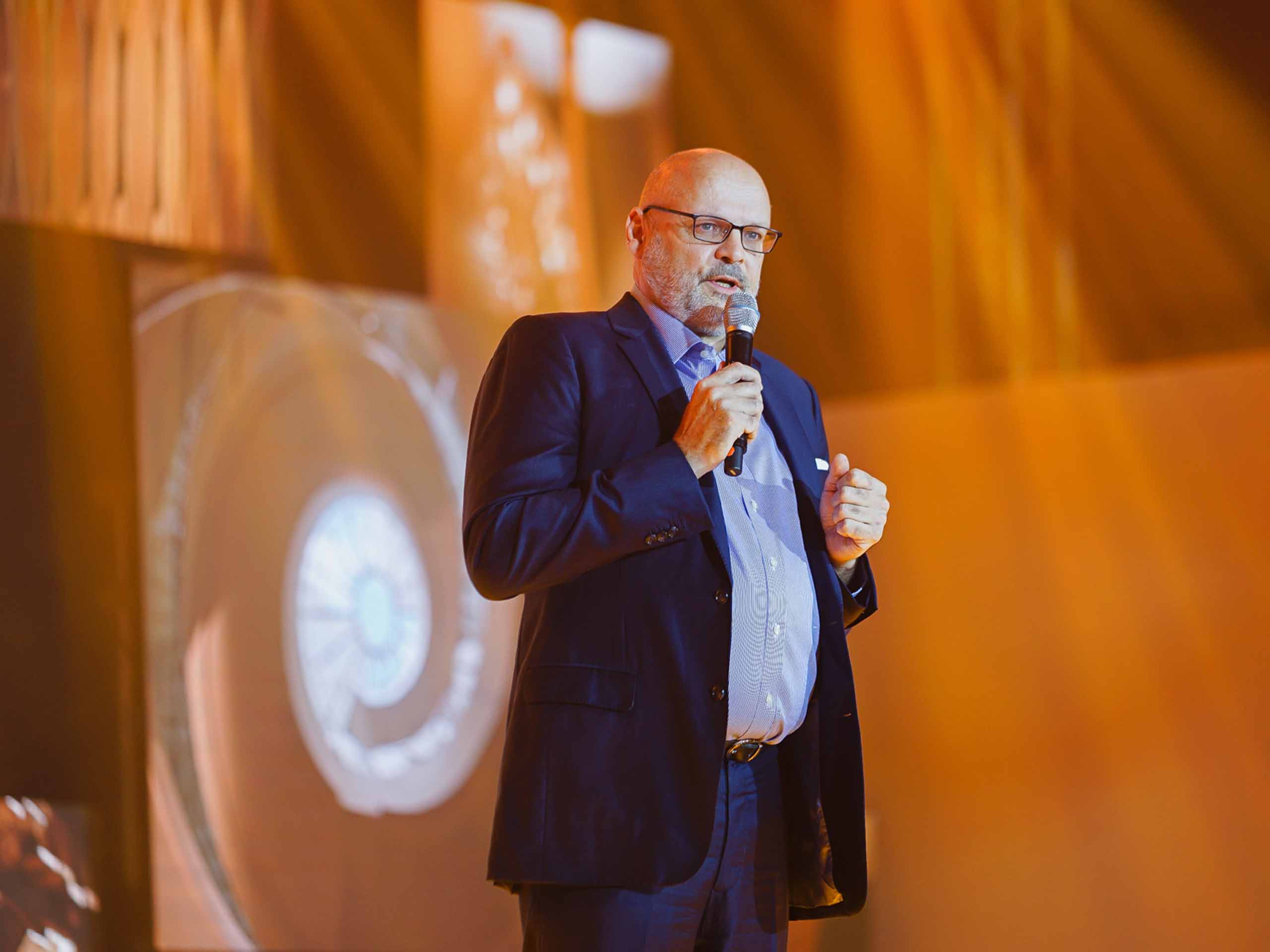 Shang Properties Executive Director Wolfgang Krueger unveiling the new crane logo