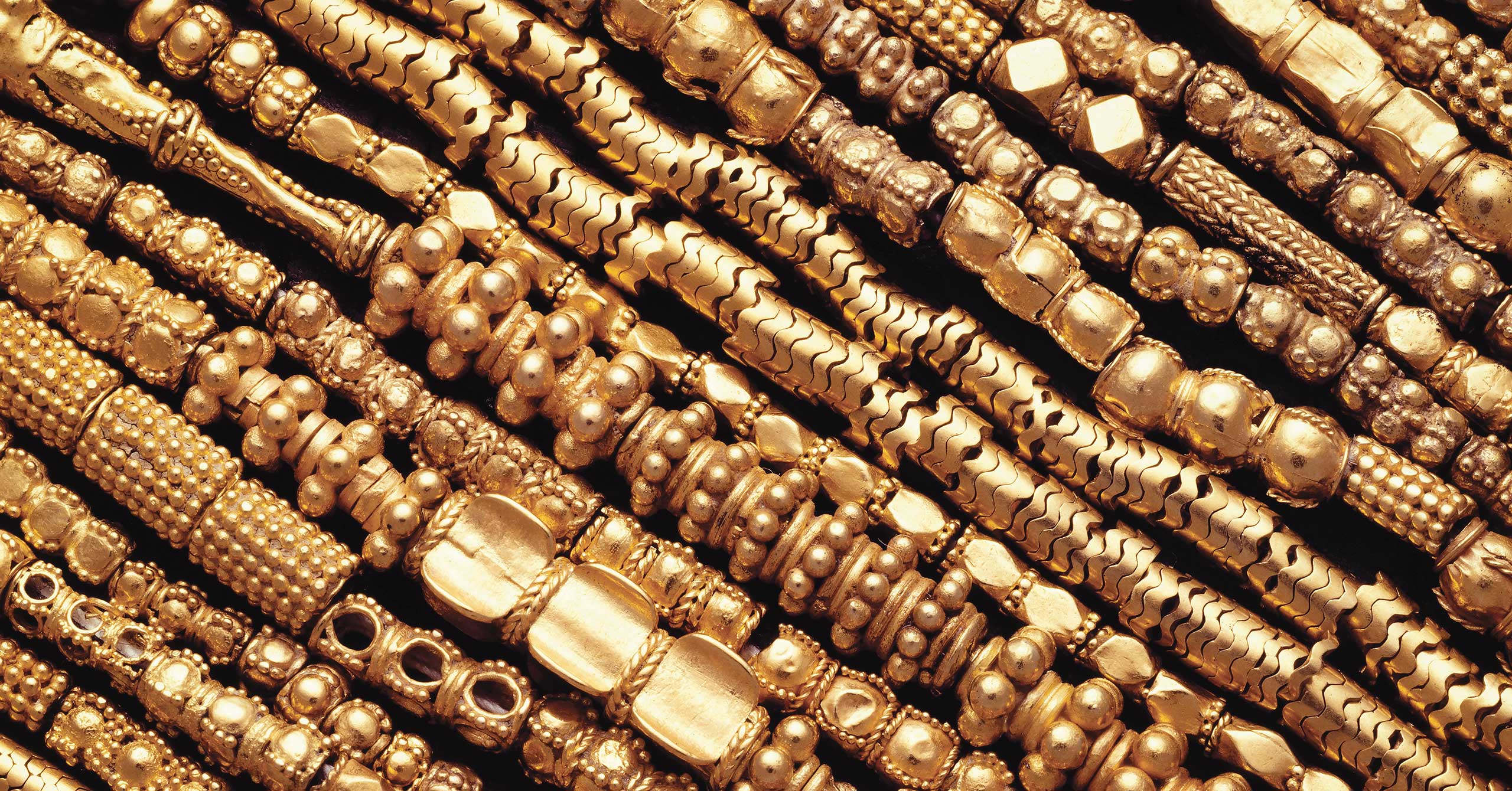 Closeup photo of various gold chains.