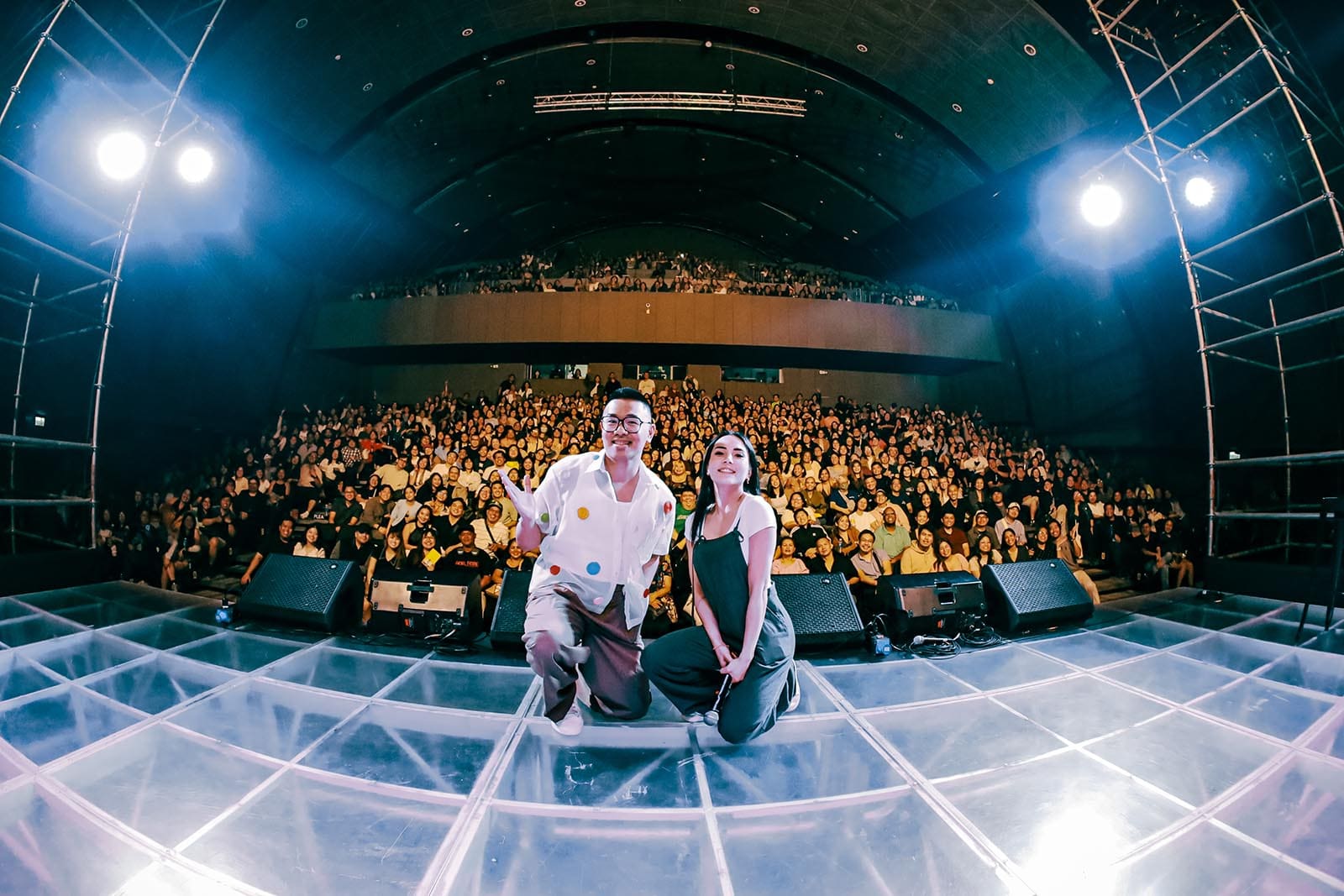 Anna Akana and Baus Rufo on stage.