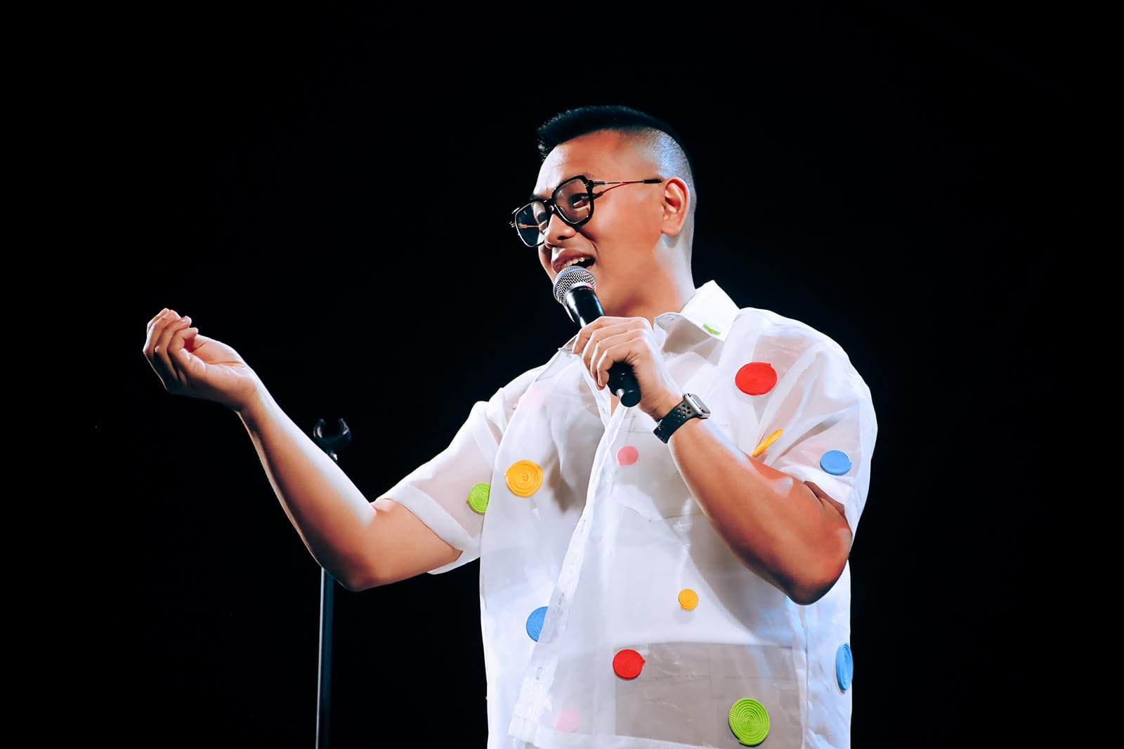Comedian Baus Rufo performing on stage.
