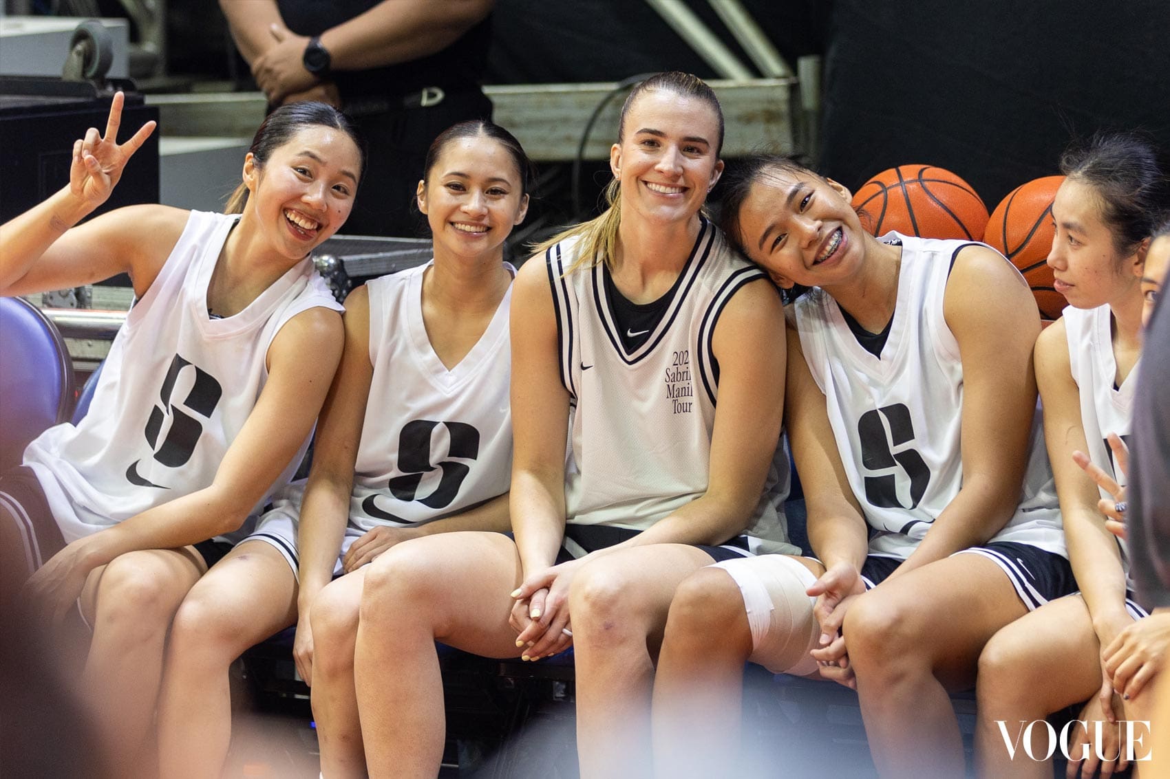 Trina Guytingco, Kai Oani, Sabrina Ionescu, Kacey Dela Rosa, and Kaye Pesquera wearing white Sabrina jerseys at the 2025 Sabrina Manila Tour showcase at SMART Araneta Coliseum.