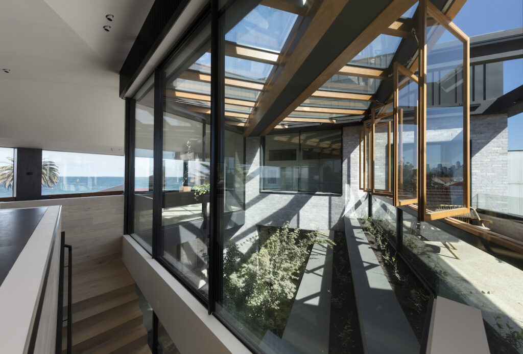 Views through to the bay are revealed slowly as you ascend internally | DesignInc’s Bio-courtyard House