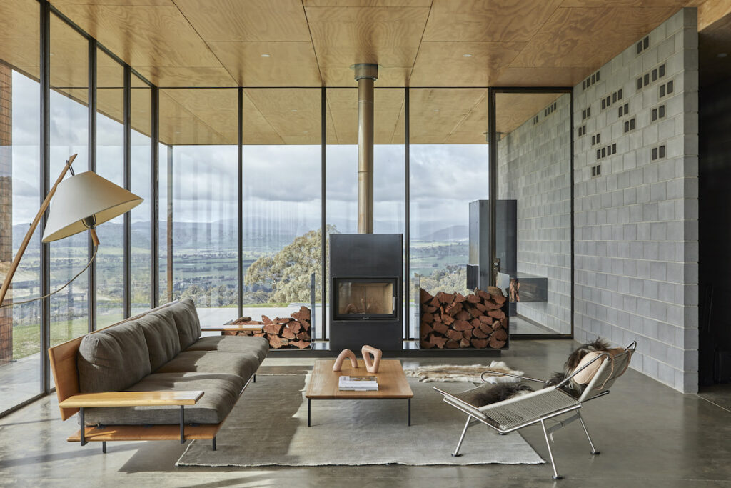 Heat from the log fire is transferred to sleeping quarters via concealed low-wattage fans | Robbie Walker’s Mansfield House