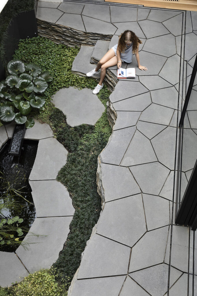 Striking irregular geometry of the bluestone paving, photographed for green magazine issue 91: Lit Up by Derek Swalwell.