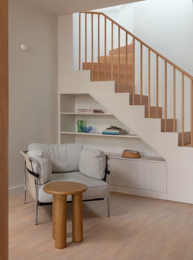 Narrow staircase with built-in shelving in living area, photographed for green magazine issue 105: Southern Calm by Joanne Ly.