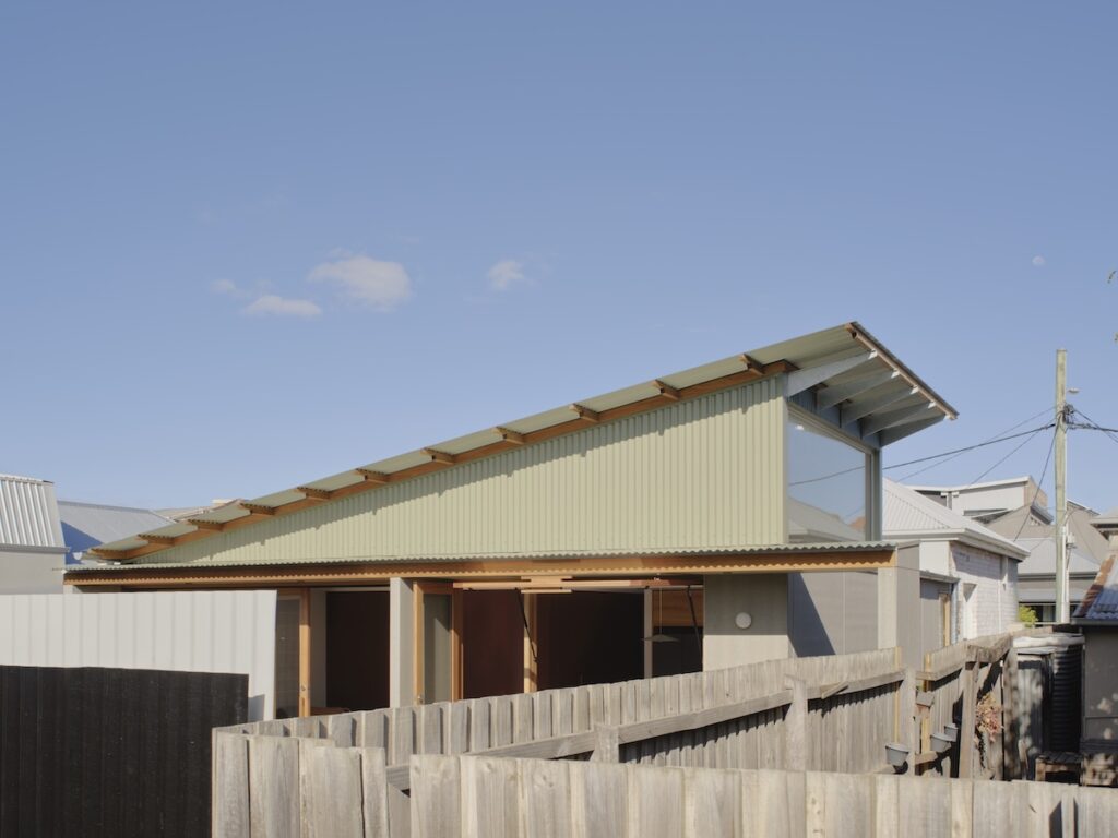 Modest addition peeking above the heritage roofline at the rear, photographed for green magazine issue 106: Embroidered by Tom Ross.