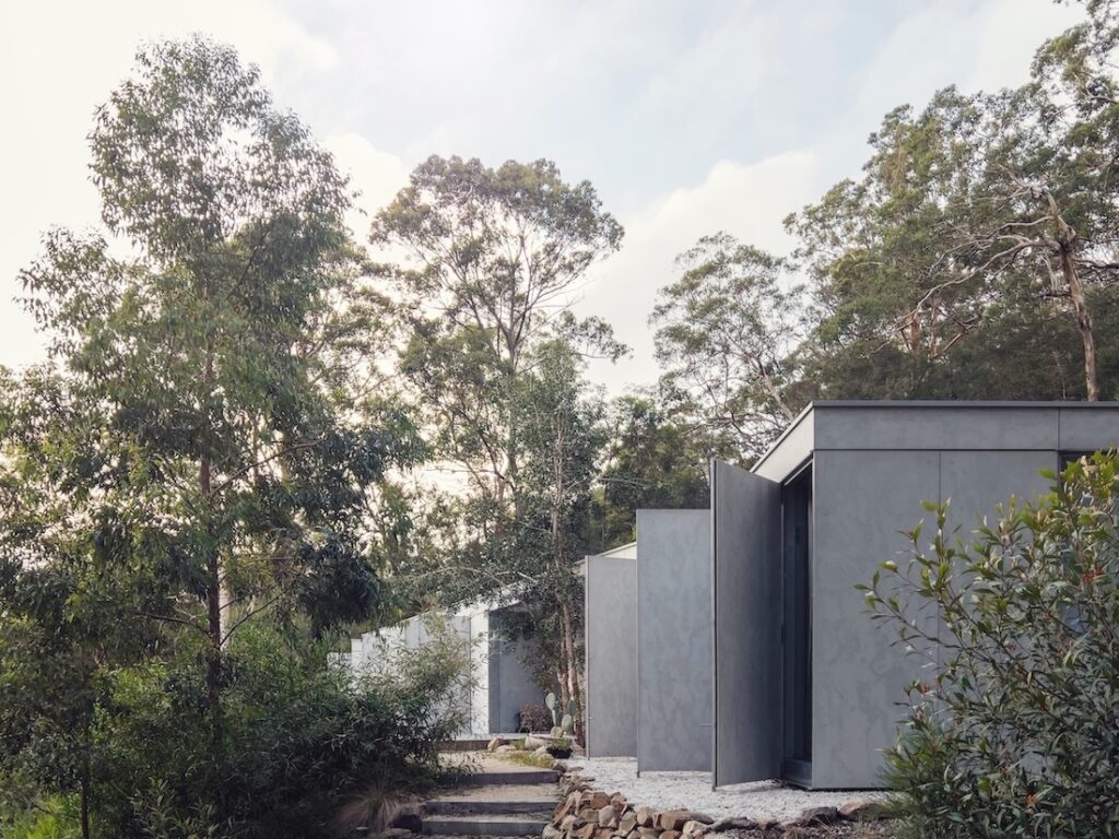 Fibre-cement sheet cladding layered over fireproof envelope, photographed for issue 106.