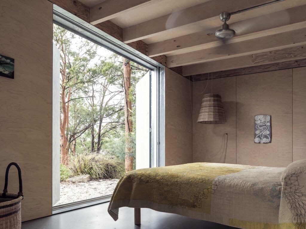 The bedrooms offer a quiet escape with views of the landscape, photographed for issue 106: Flame Trees by Justin Alexander.