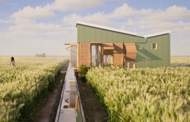 A small prefabricated house elevated above agricultural fields, with rainwater channels leading toward the structure and vegetation surrounding the site.