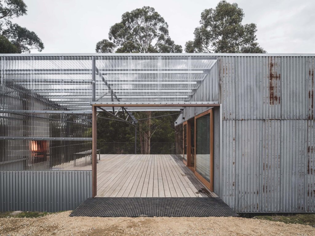 Protected from dry winds and with a view to Simpsons Bay, the polycarbonate-covered deck is where most year-round living takes place; it also denotes the entry to the house, photographed for issue 107: Assemblage by Adam Gibson.