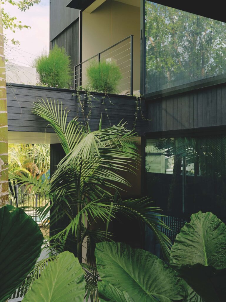 From roof terraces to the central garden void, each half level enjoys a dedicated outdoor connection, enriching the home with varied atmospheres and experiences, photographed for issue 107: A Coastal Compact by Tom Ross.