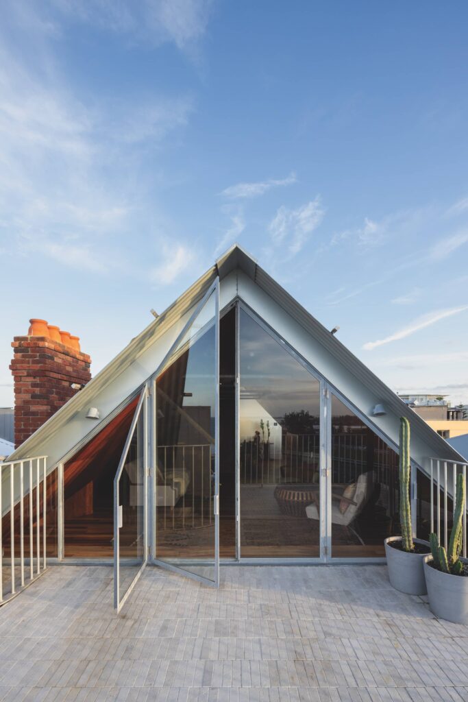 Upper-floor living space and terrace at Fort House overlooking the city, harbour and beach, photographed for issue 108: Out Look by Clinton Weaver.
