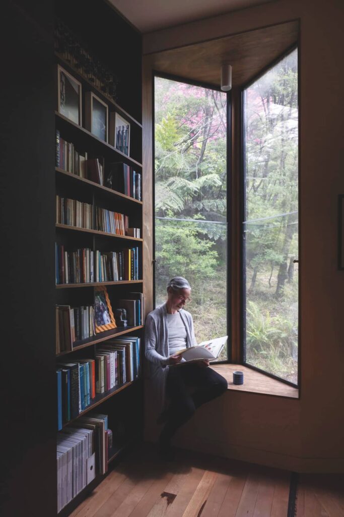 Study and guest room reading nook with garden views at Cascading Effect, photographed by Brett Boardman.