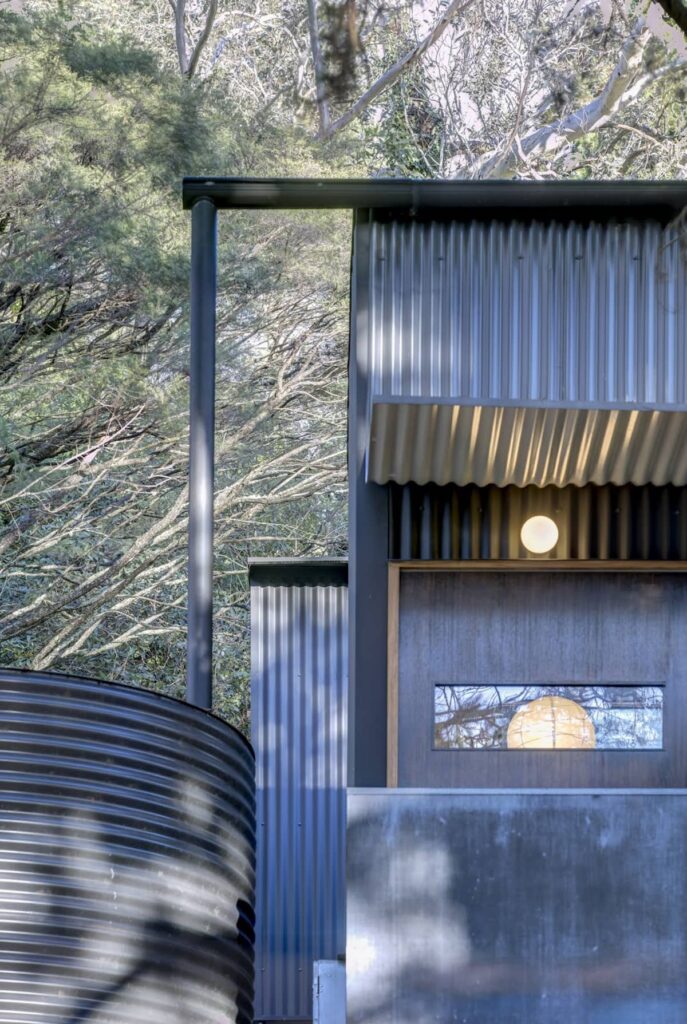 Roof sprinkler system and water tank at Cascading Effect house, photographed by Brett Boardman.