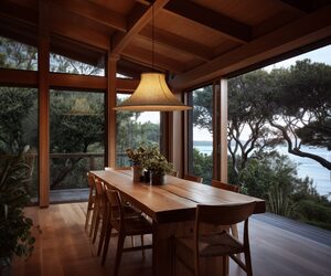 Wool pendant lighting by Lof, featuring the Bloem 80 above a dining table in a beautiful coastal home.