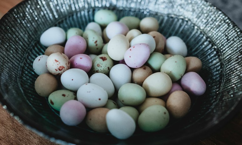 Close up of pastel easter eggs in a metallic bowl
