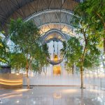 entranceway filled with arches and trees