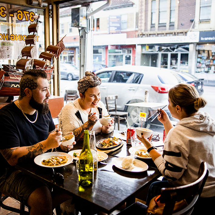Friends enjoying lunch at Green Fields Restaurant on Sydney Road Brunswick