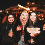 Three friends enjoying cocktails on the rooftop of the Cornish Arms Hotel on Sydney Road Brunswick