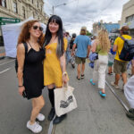 Two friends enjoying the Sydney Road Street Party in Brunswick