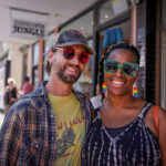 Two friends enjoying the Sydney Road Street Party in Brunswick
