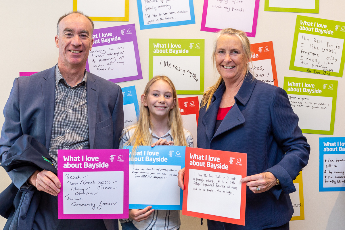 family of three with big ideas card