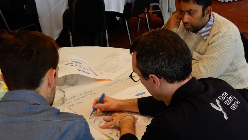 Image of participants discussing collaboration