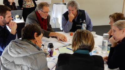 Image of participants discussing collaboration