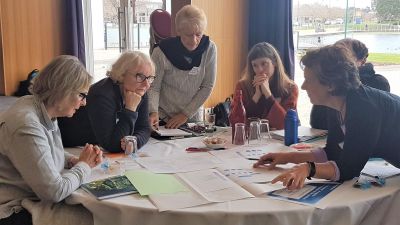 Participants discussing implementation