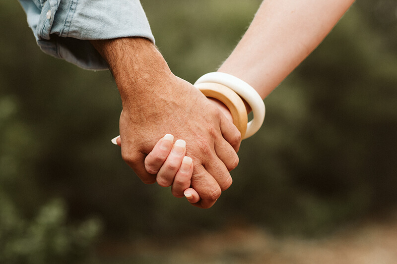 Close up of a couple holding hands
