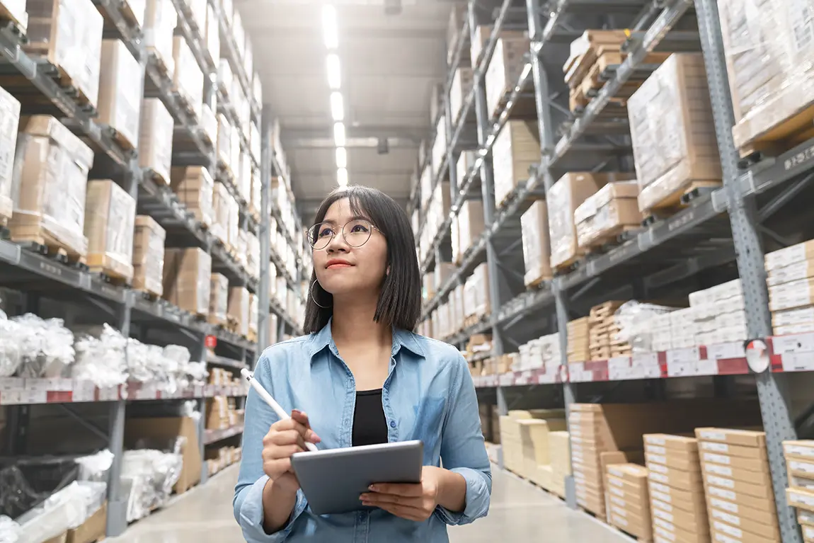 female manager checking stocks in a warehouse