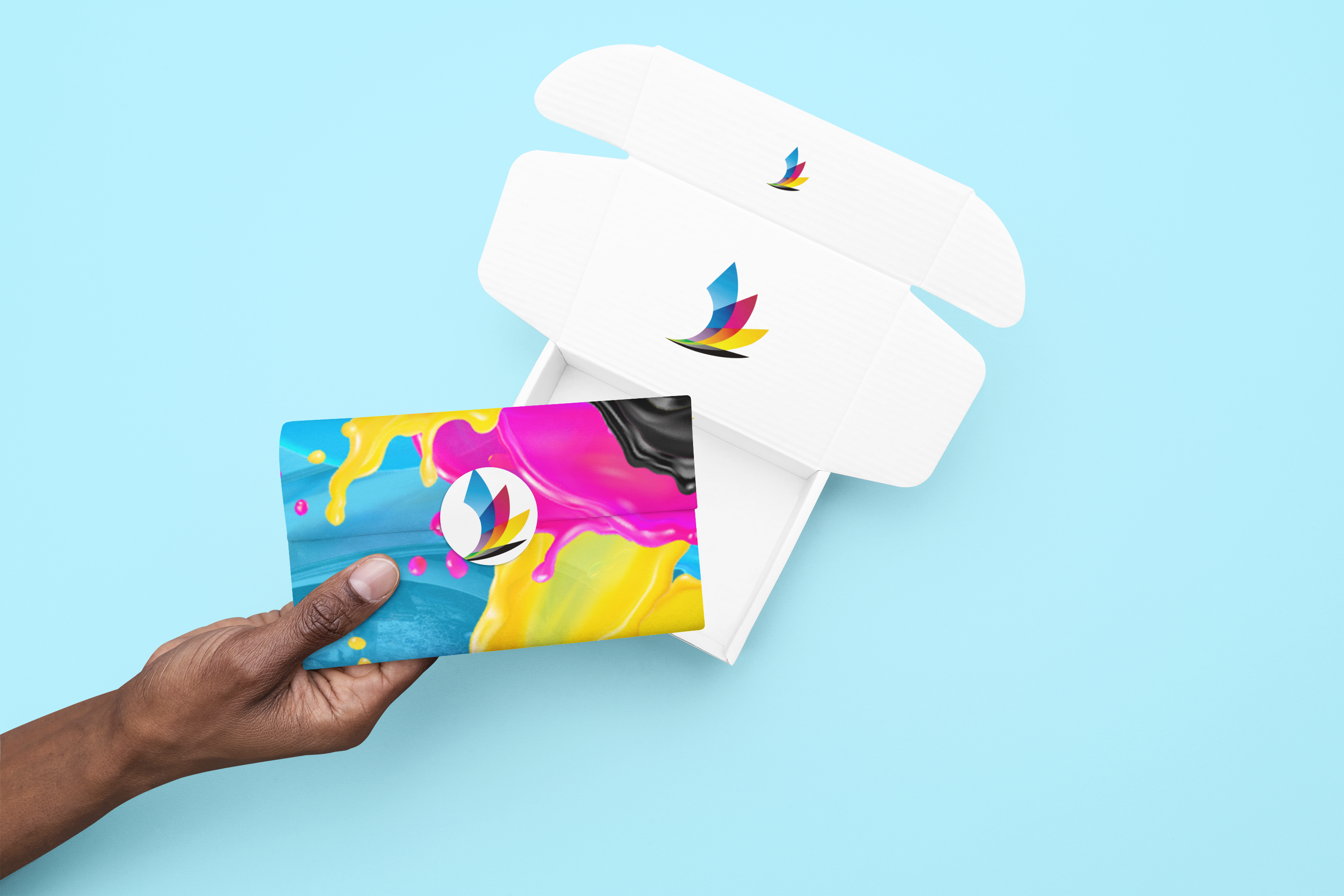 Box mockup featuring a person holding a piece of wrapping paper with a sticker m32465 2