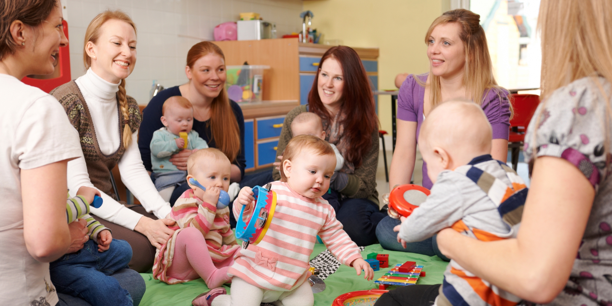 Playgroups Inclusion Project Focus Group with Kiind and Playgroup WA banner. The banner consists of an image of a playgroup with a group of mums and children in a play room