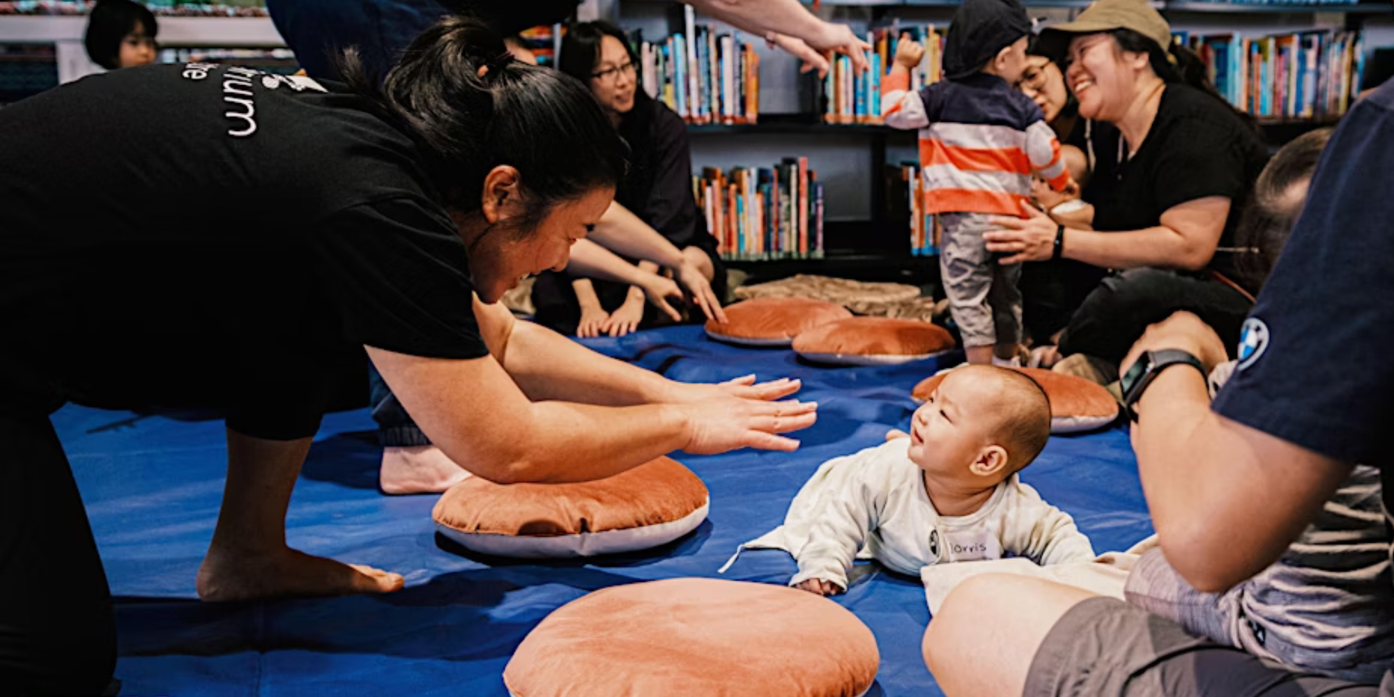 Library Sensory Rhymetime with Subiaco Library banner. The banner consists of an image of a groups children, parents and staff members interacting with one another in a library