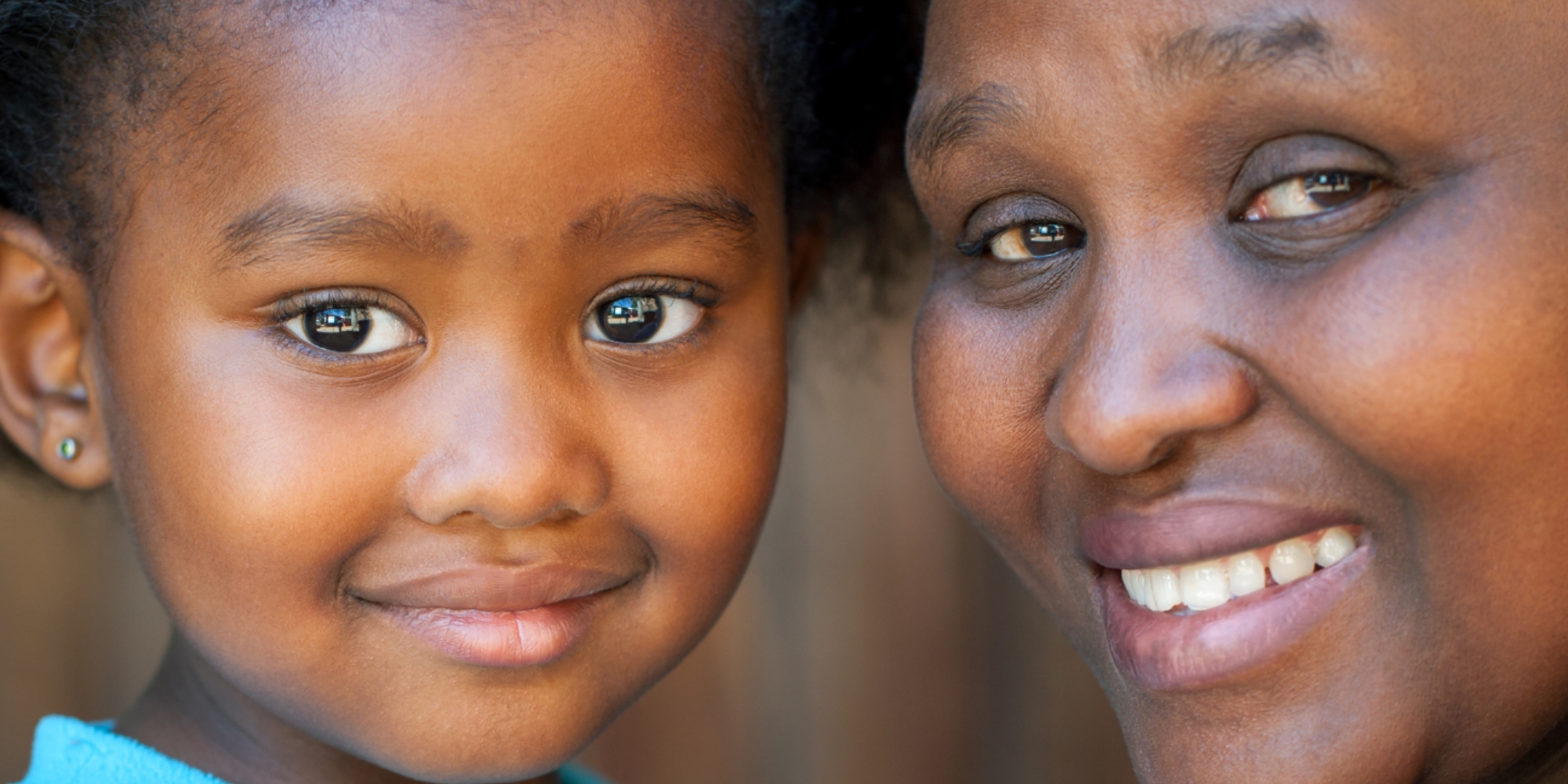 Parenting Across Cultures workshop with Communicare banner. The banner consists of a close up image of a mother and her children looking and smiling at the camera.